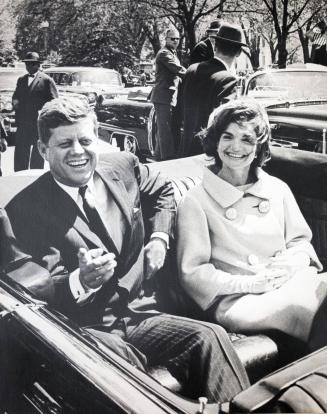 Photograph of John and Jacqueline Kennedy in Convertible