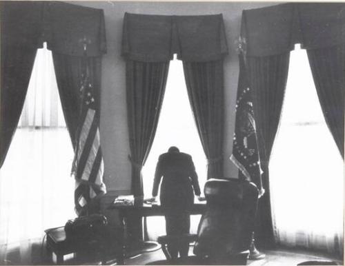Photograph of President Kennedy in Oval Office