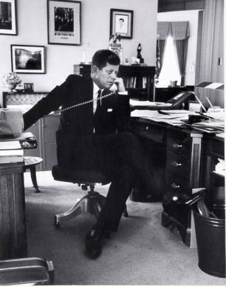 Photograph of President Kennedy Talking on Telephone