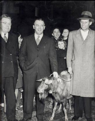 Photograph of John F. Kennedy at Bunker Hill Council of the Knights of Columbus Leading A Goat