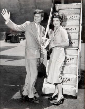 Photograph of Senator Kennedy and Jacqueline Kennedy Boarding a Plane