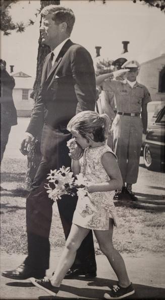 Photograph of President Kennedy Walking with Caroline Kennedy