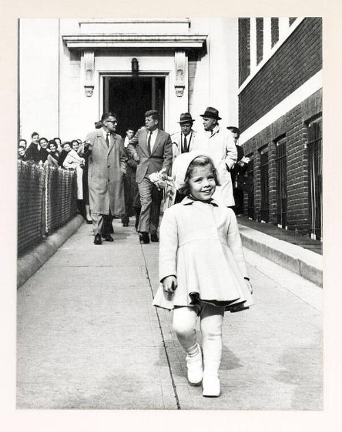 Photograph of Caroline Kennedy in Coat, Cap, and Tights