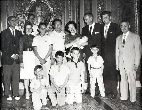 Photograph of Senators Kennedy, Johnson, and Patore with Group of People