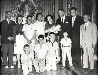 Photograph of Senators Kennedy, Johnson, and Patore with Group of People