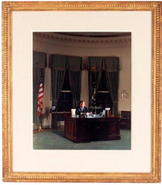 Photograph of President Kennedy in Oval Office